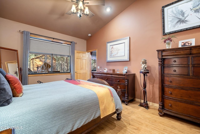 bedroom featuring lofted ceiling and light hardwood / wood-style floors