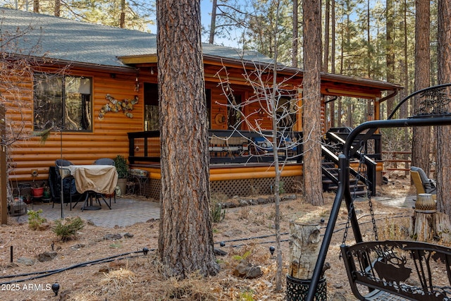 view of property exterior featuring a patio area