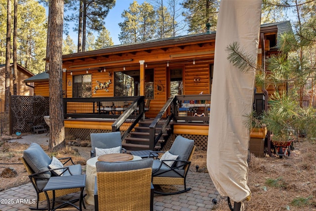 rear view of house featuring a patio