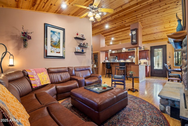 living room featuring wood ceiling, ceiling fan, lofted ceiling, and light hardwood / wood-style flooring