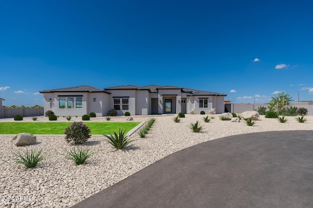 rear view of property with a lawn