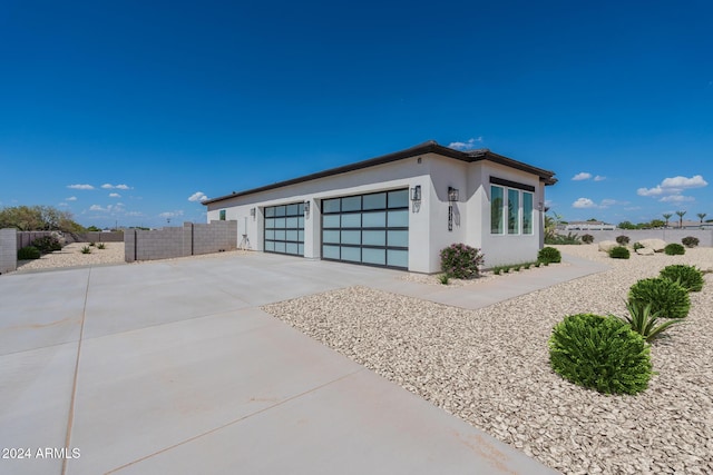 view of side of home featuring a garage