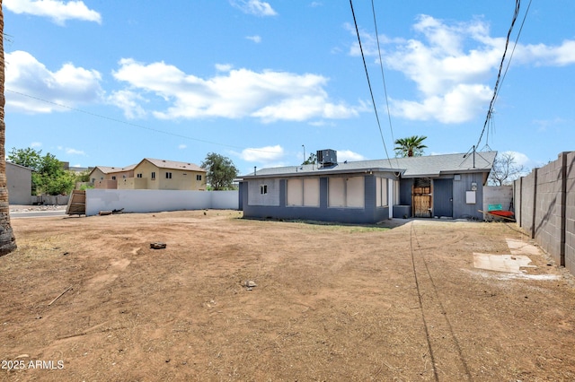 back of house with fence and cooling unit