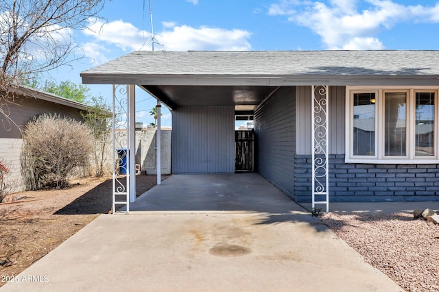 view of parking / parking lot with concrete driveway