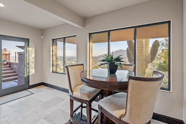 dining room featuring beam ceiling