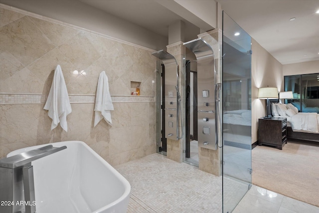 bathroom featuring separate shower and tub and tile walls