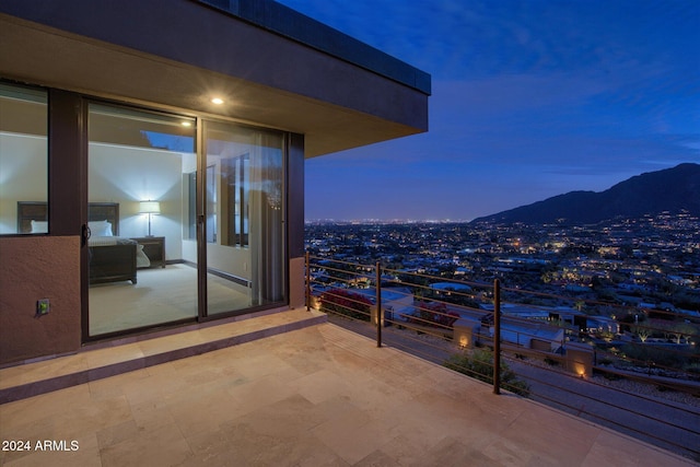 balcony at dusk with a mountain view