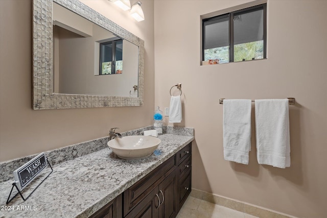 bathroom with tile patterned flooring and vanity