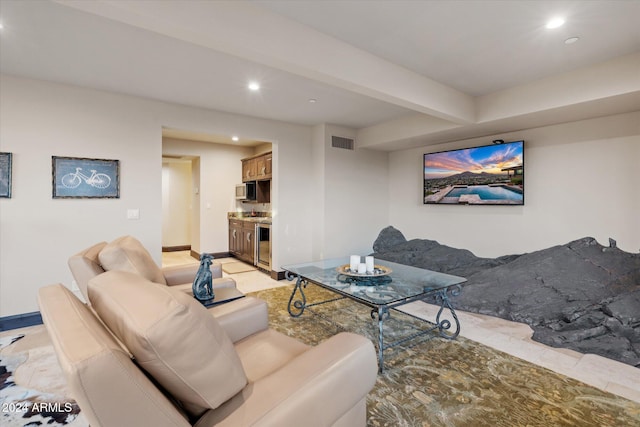 living room with beamed ceiling