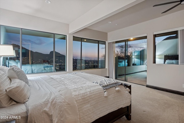 bedroom featuring carpet, access to outside, and ceiling fan