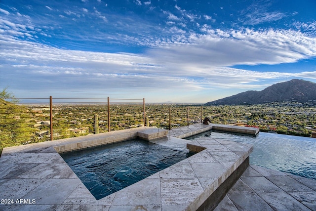 view of pool featuring a mountain view