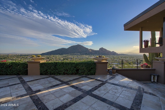 view of patio / terrace with a mountain view and a balcony