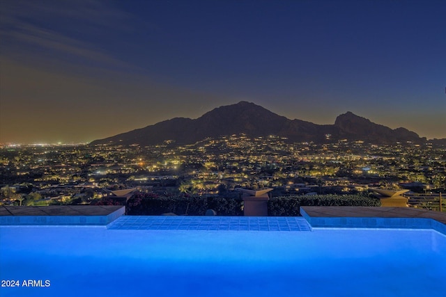 view of pool with a mountain view