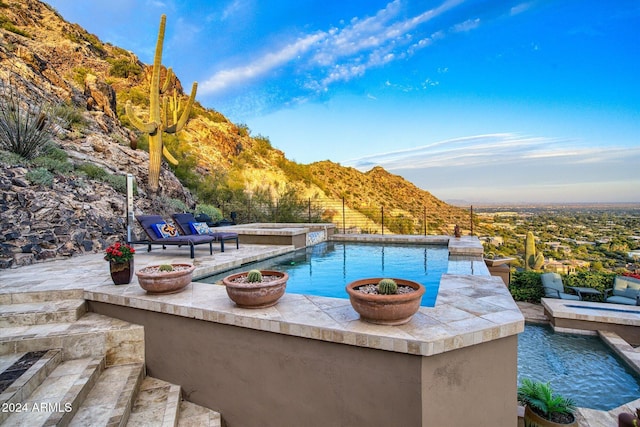 view of pool with a mountain view