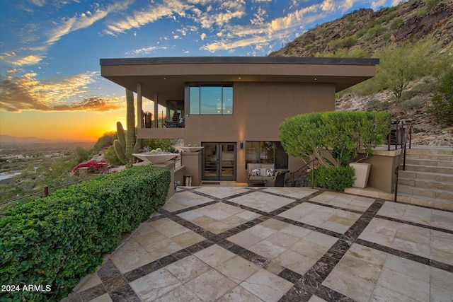 exterior space with french doors and a patio area