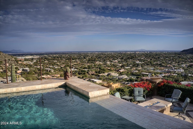 view of swimming pool with a water view