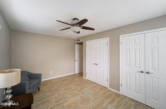 8141 N Central Ave Unit 9, Phoenix, AZ 85020 - sitting room featuring a ceiling fan, baseboards, and light wood-type flooring