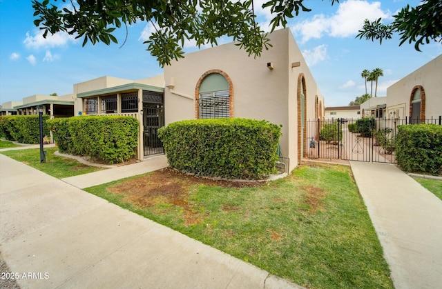 8141 N Central Ave Unit 9, Phoenix, AZ 85020 - view of front facade featuring stucco siding and a gate