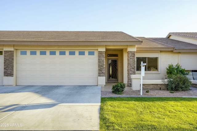 view of front facade with stucco siding, stone siding, concrete driveway, a front yard, and a garage