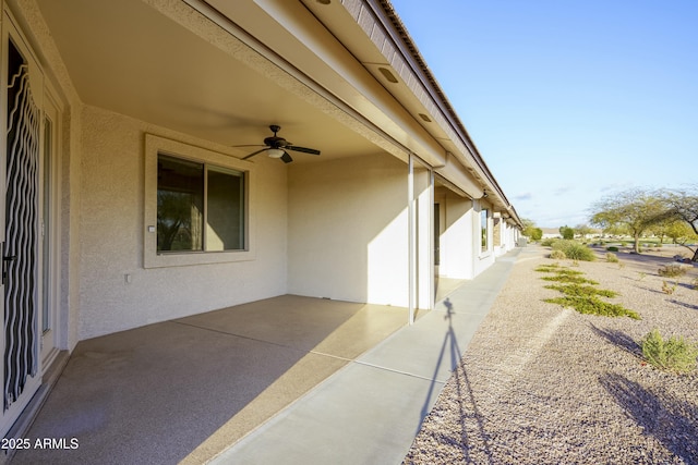 view of patio featuring ceiling fan