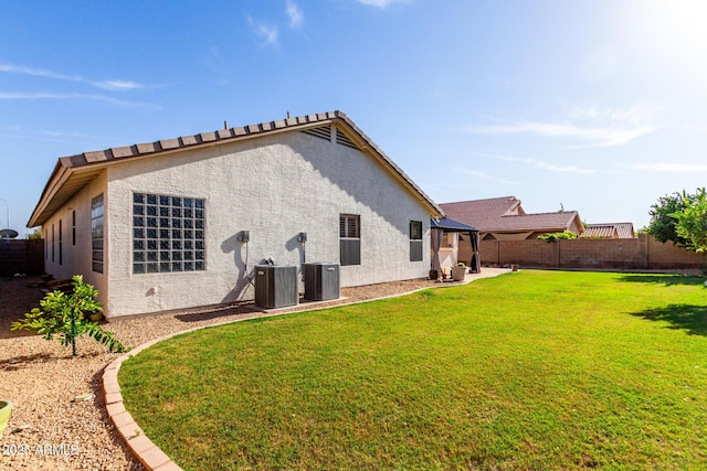 2230 E Whitten St, Chandler, AZ 85225 - rear view of property featuring stucco siding, a fenced backyard, and a patio area