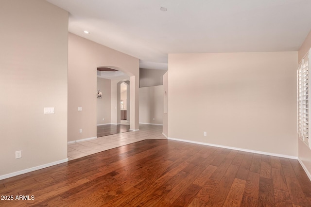2230 E Whitten St, Chandler, AZ 85225 - unfurnished room with arched walkways, wood finished floors, vaulted ceiling, and recessed lighting