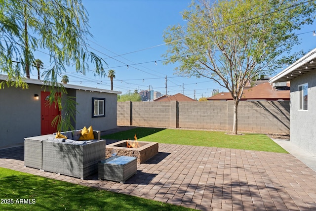 view of patio featuring an outdoor living space with a fire pit and a fenced backyard