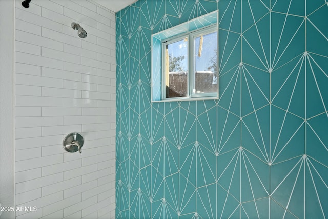 full bath featuring a tile shower