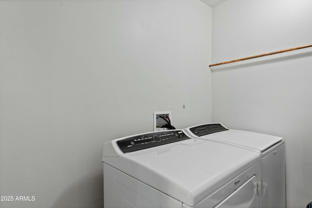 laundry area with laundry area and separate washer and dryer