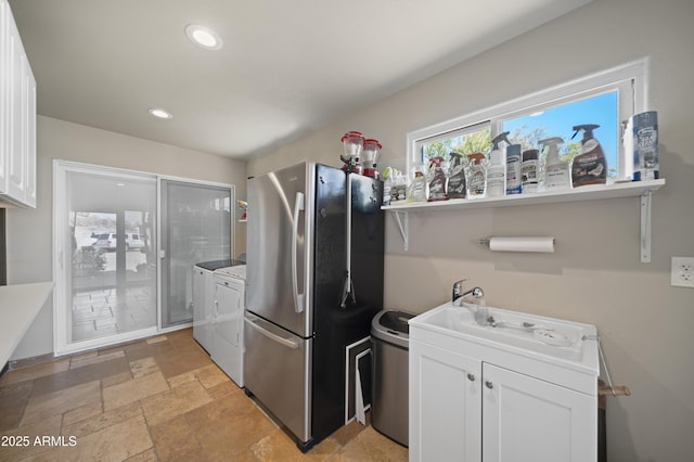 1185 S Camino Cobre Dr, Wickenburg, AZ 85390 - clothes washing area with recessed lighting, washer and clothes dryer, and stone tile floors