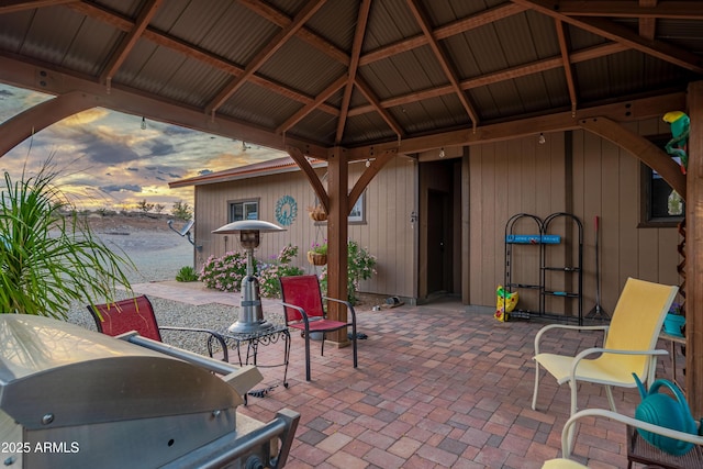 1185 S Camino Cobre Dr, Wickenburg, AZ 85390 - patio terrace at dusk with area for grilling and a gazebo