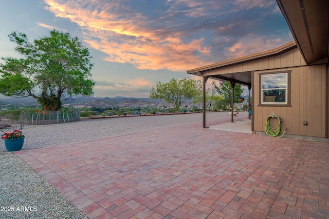 1185 S Camino Cobre Dr, Wickenburg, AZ 85390 - patio terrace at dusk with a mountain view