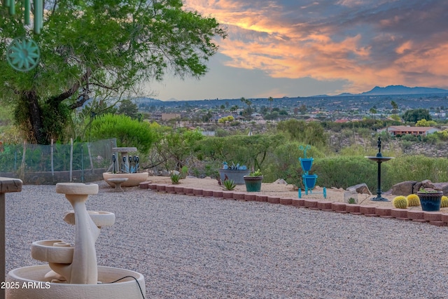 1185 S Camino Cobre Dr, Wickenburg, AZ 85390 - yard at dusk featuring a mountain view and a patio area