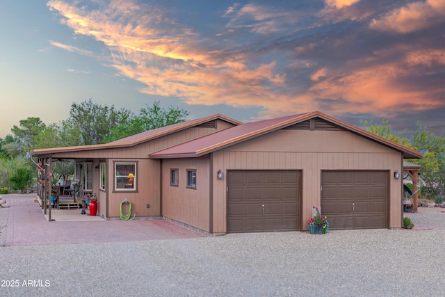 1185 S Camino Cobre Dr, Wickenburg, AZ 85390 - rustic home featuring driveway, a garage, and metal roof