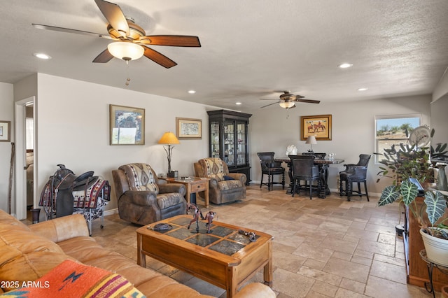 1185 S Camino Cobre Dr, Wickenburg, AZ 85390 - living area featuring baseboards, recessed lighting, stone tile floors, and ceiling fan