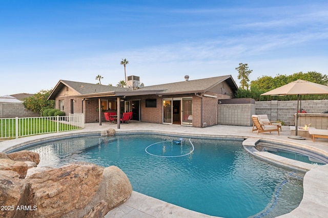 view of pool featuring central AC, a patio, and an in ground hot tub