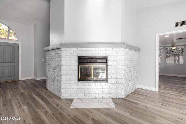 3315 E Hampton Ave, Mesa, AZ 85204 - detailed view of wood finished floors and a brick fireplace
