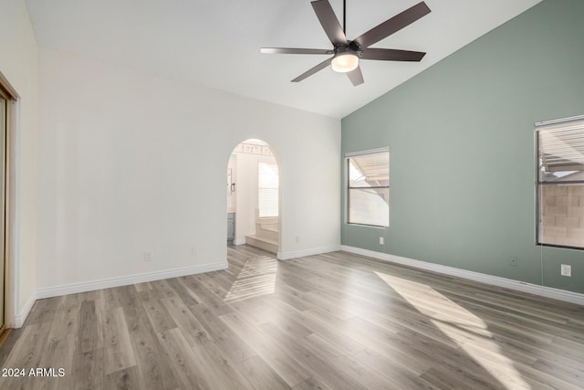 3315 E Hampton Ave, Mesa, AZ 85204 - empty room featuring ceiling fan, wood finished floors, high vaulted ceiling, and arched walkways