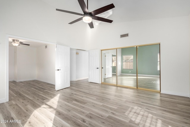 3315 E Hampton Ave, Mesa, AZ 85204 - unfurnished bedroom featuring high vaulted ceiling, wood finished floors, a ceiling fan, and a closet
