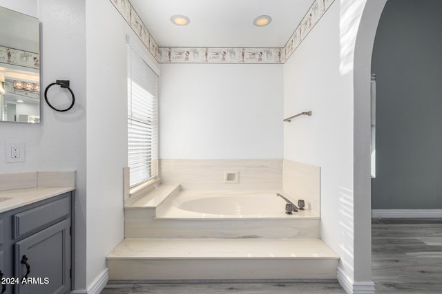 3315 E Hampton Ave, Mesa, AZ 85204 - full bathroom with vanity, a garden tub, wood finished floors, and recessed lighting