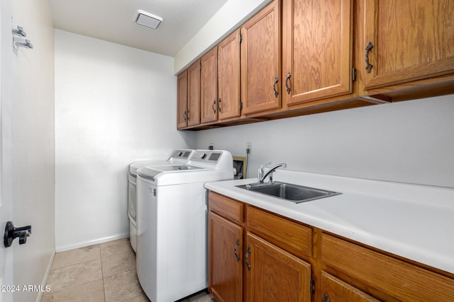 3315 E Hampton Ave, Mesa, AZ 85204 - laundry area with cabinet space, washing machine and dryer, and light tile patterned flooring