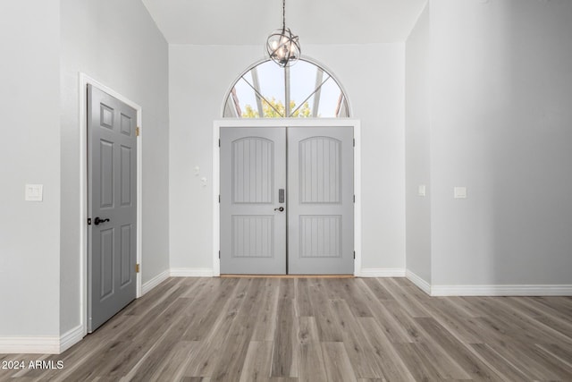 3315 E Hampton Ave, Mesa, AZ 85204 - entryway featuring light wood-style floors and a chandelier