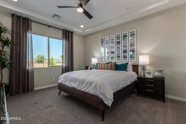 27647 N 176th Dr, Surprise, AZ 85387 - carpeted bedroom with baseboards, recessed lighting, a tray ceiling, and a ceiling fan