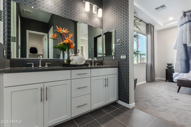 27647 N 176th Dr, Surprise, AZ 85387 - bathroom featuring baseboards, double vanity, recessed lighting, and tile patterned floors