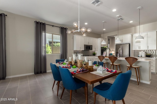 27647 N 176th Dr, Surprise, AZ 85387 - dining space featuring baseboards, recessed lighting, a chandelier, and light tile patterned floors