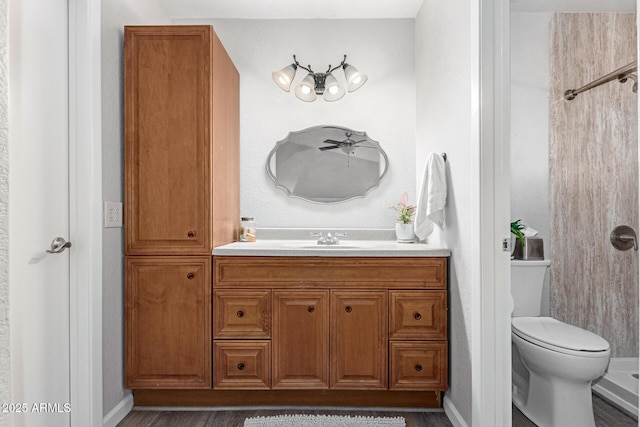 bathroom featuring hardwood / wood-style flooring, vanity, and toilet