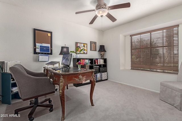 office space with light colored carpet and ceiling fan