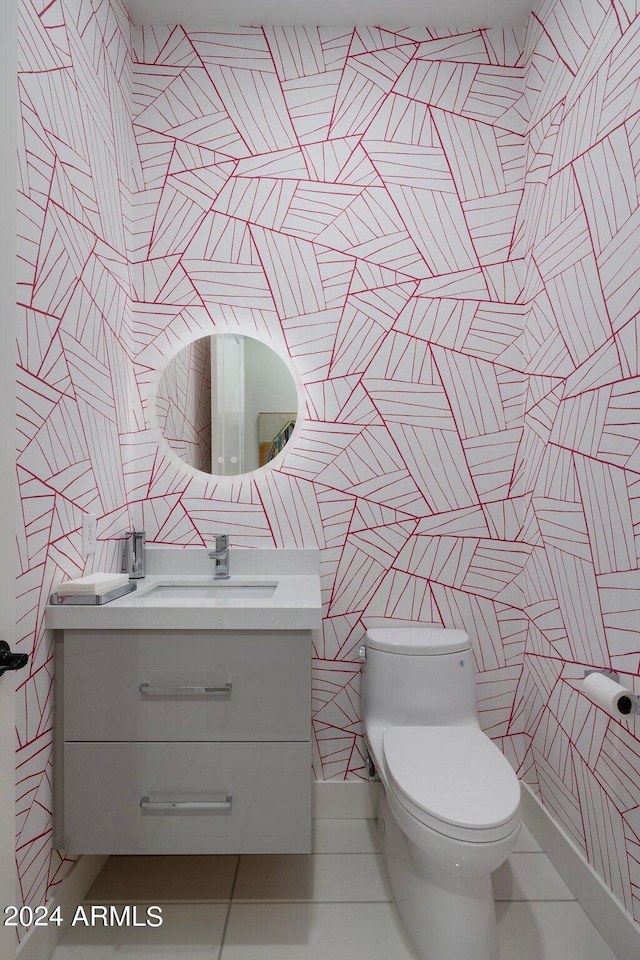 bathroom with vanity, toilet, and tile patterned floors