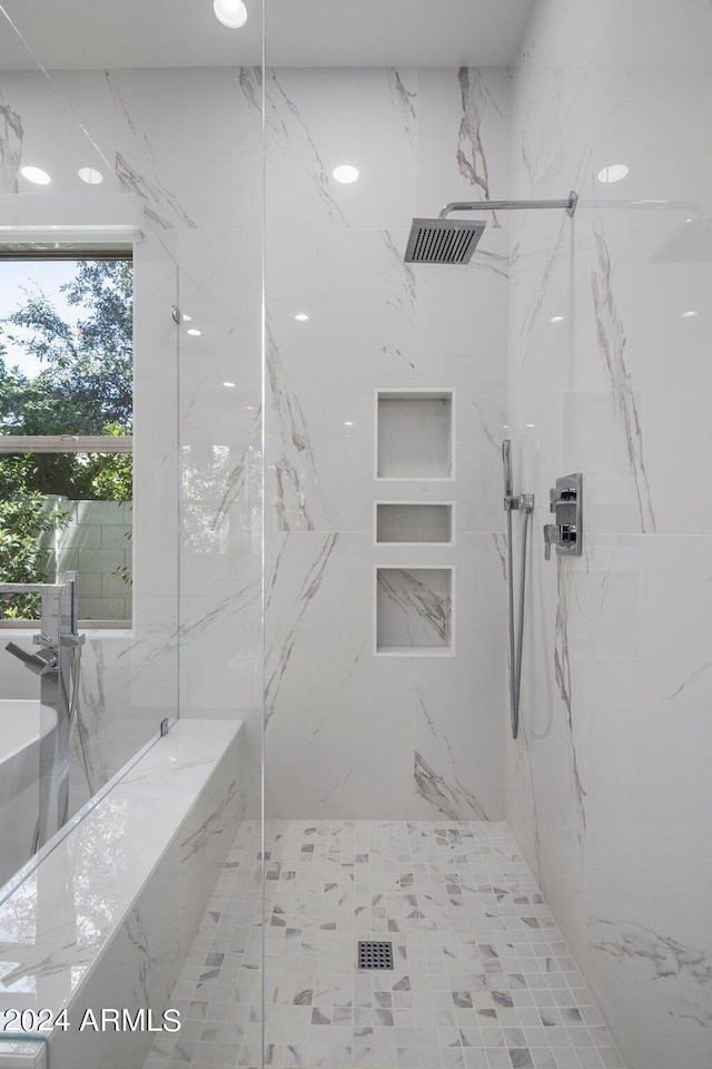 bathroom with a tile shower