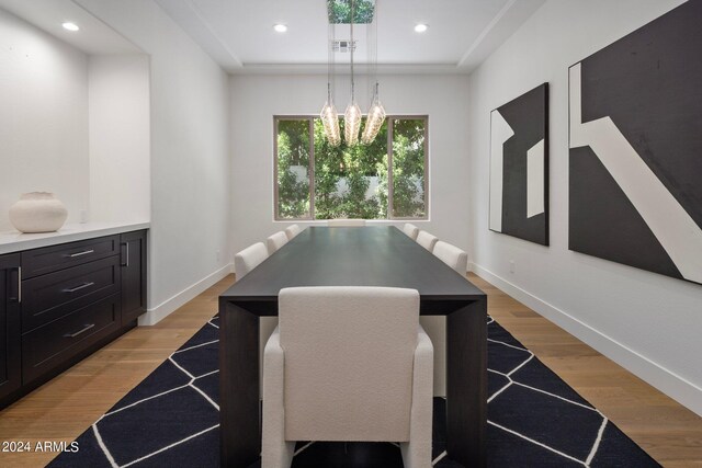 dining space with light hardwood / wood-style flooring